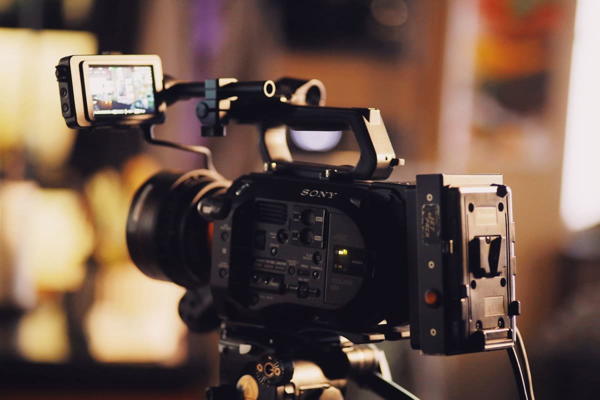 A professional cinema camera on a lit production set