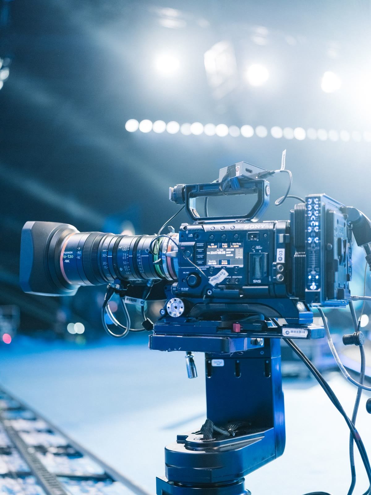 A professional cinema camera on a lit production set